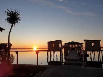 Scenic view of beach against sky during sunset