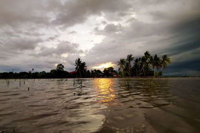 Scenic view of sea against sky at sunset