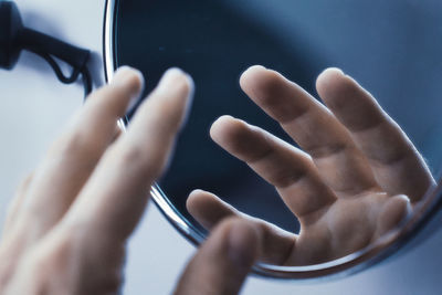 Close-up of hand using mobile phone