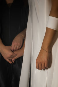 Low section of man and woman standing on floor