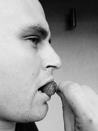 Close-up portrait of young man looking away