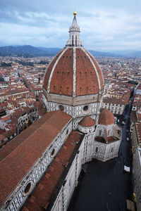 High angle view of city buildings against sky