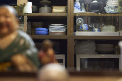 Close-up of men on shelf