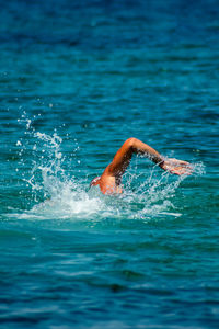 Man swimming in sea