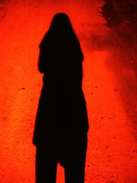 Close-up of woman standing on tiled floor