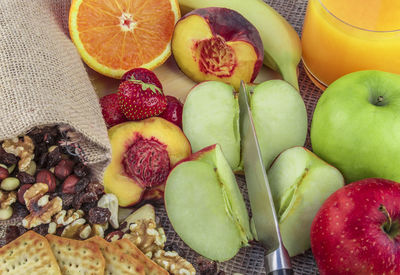 Close-up of biscuits fruits and juice