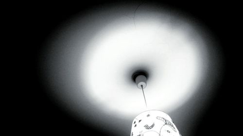 Low angle view of illuminated light bulb