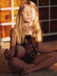 Portrait of a girl looking down while sitting