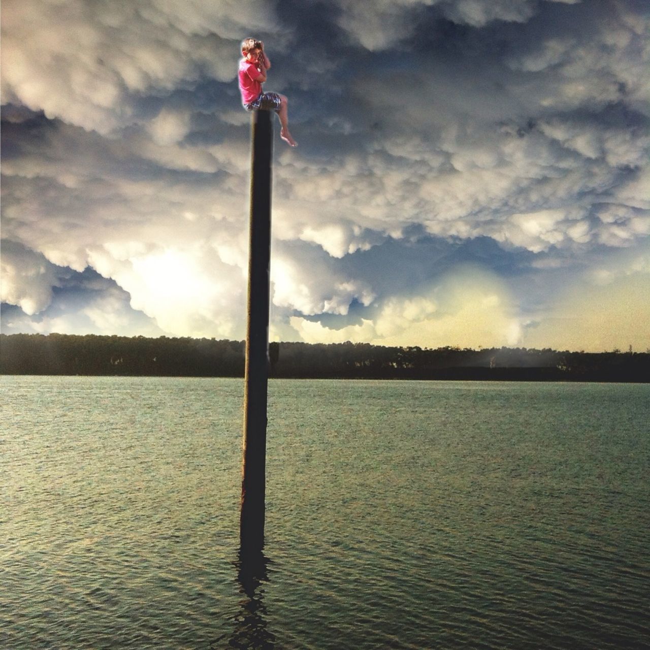 sky, water, tranquil scene, cloud - sky, tranquility, lake, sunset, cloud, waterfront, reflection, scenics, nature, beauty in nature, rippled, pole, idyllic, cloudy, sea, no people, outdoors