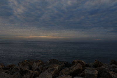 Scenic view of sea against sky at sunset