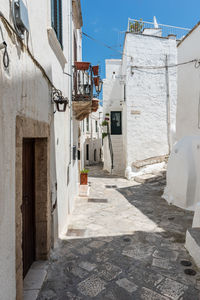 Alley amidst buildings in city