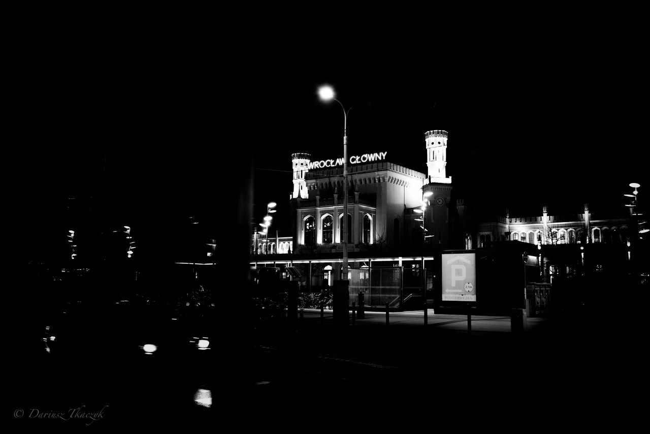 Train station in Wro Night Illuminated Building Exterior Architecture City Street Built Structure No People Text Dark Street Light Copy Space Western Script Outdoors Sky Nature Arts Culture And Entertainment City Life Communication Sign
