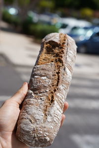 Close-up of hand holding bread