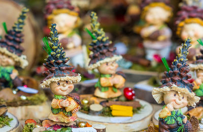 Close-up of figurines for sale in store