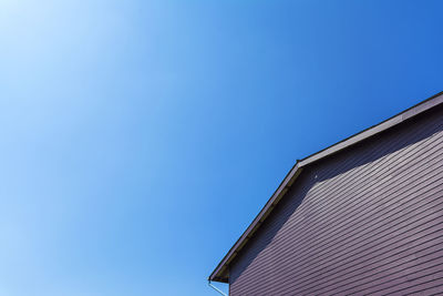 Low angle view of building against blue sky