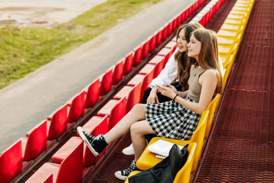 Young woman sitting on chair