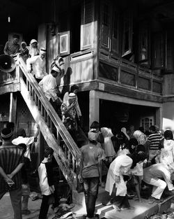 People are downing the stairs after attending religious invitation 