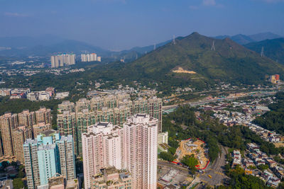 High angle view of city buildings against sky