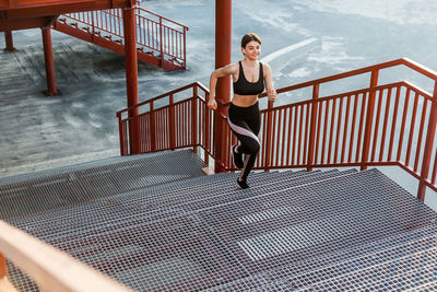 Full length of woman on railing