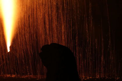 Full length portrait of silhouette man standing at night