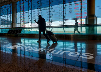 Angry travelers walking to the departure gate. delay or cancelled flight. airlines strike concept