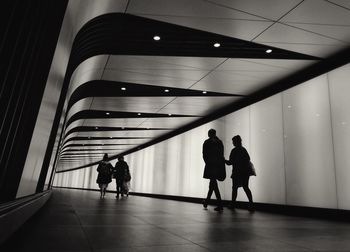 Low angle view of men walking on staircase