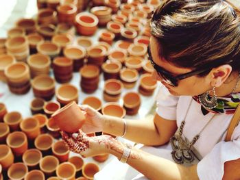 High angle view of woman holding earthenware