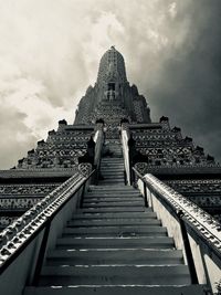 Low angle view of temple against cloudy sky