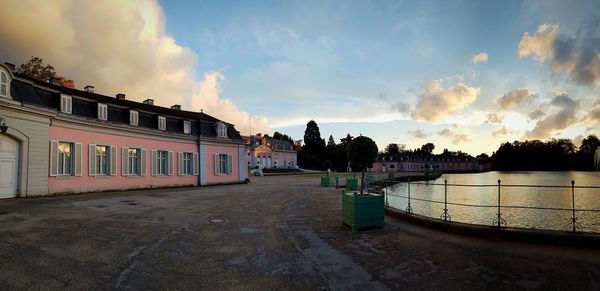 Panoramic view of buildings against sky at sunset