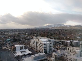 Aerial view of cityscape against sky