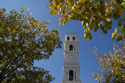 Low angle view of bell tower against sky