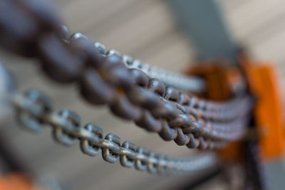 Close-up of metal chain on pulley
