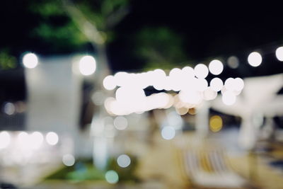 Defocused image of illuminated lights at night