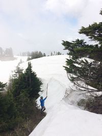 High angle view of person on snow covered landscape