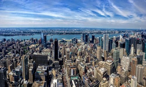 High angle view of modern buildings in city against sky