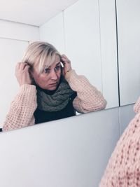 Reflection of woman in mirror