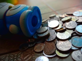 High angle view of coins on table