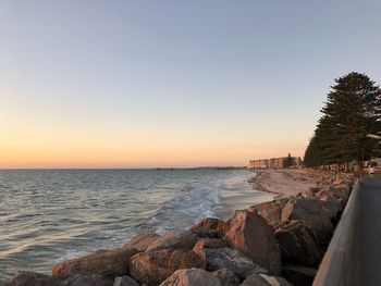 Scenic view of sea against clear sky during sunset