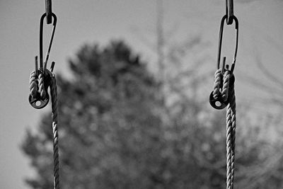 Close-up of swing hanging on rope