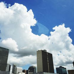 Low angle view of modern buildings against sky