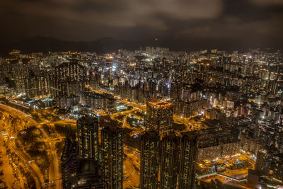 High angle view of illuminated city buildings at night