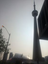 Low angle view of street and buildings against sky