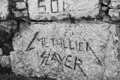 Close-up of text on wall