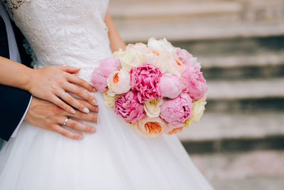 Close-up of hand holding flower bouquet