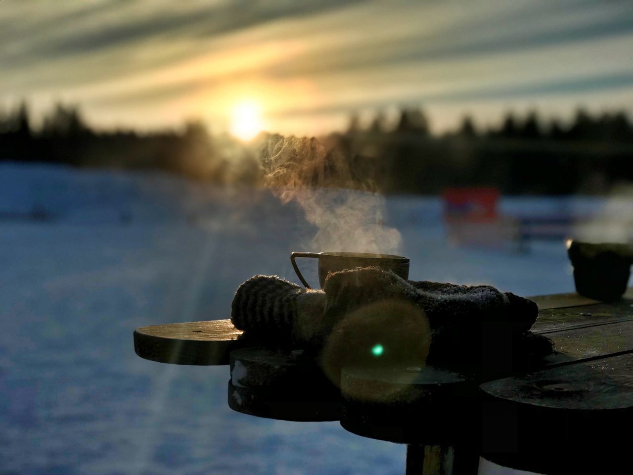 water, focus on foreground, nature, sky, sunset, no people, close-up, outdoors, reflection, cloud - sky, lake, day, steam, sunlight, selective focus, cup, metal, smoke - physical structure, lighting equipment