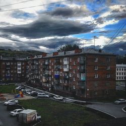 City street against cloudy sky