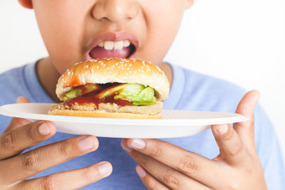 Midsection of woman eating food