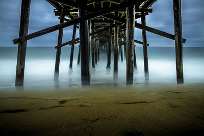 View of pier on sea against sky