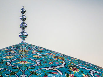 Low angle view of illuminated building against clear sky