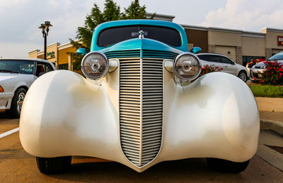Front facing view of a vintage car.